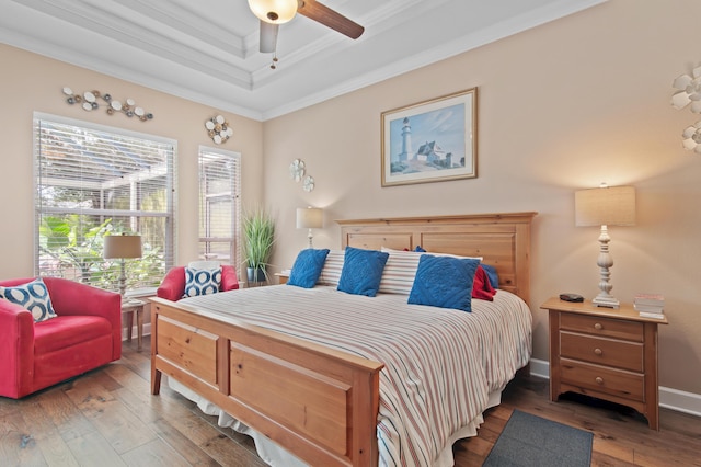 6341 Augusta Cv, Destin, FL 32541 - bedroom featuring a raised ceiling, crown molding, and hardwood / wood-style floors
