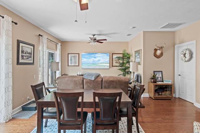 6341 Augusta Cv, Destin, FL 32541 - dining space featuring a ceiling fan and wood finished floors