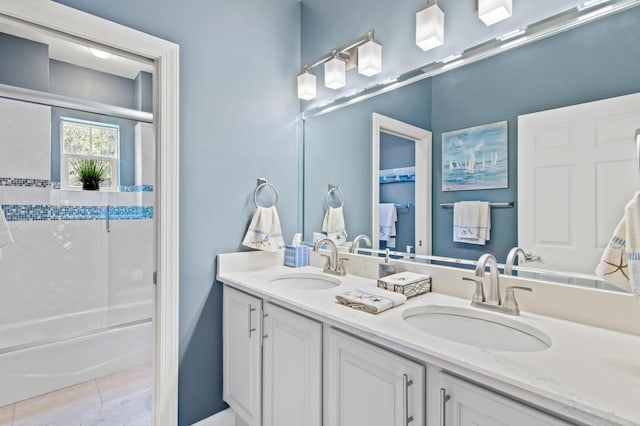 6341 Augusta Cv, Destin, FL 32541 - full bathroom with double vanity, shower / bath combination with glass door, and tile patterned flooring