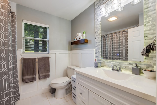 5981 Creekside Cir, Crestview, FL 32536 - full bath with vanity, tile patterned floors, wainscoting, and curtained shower