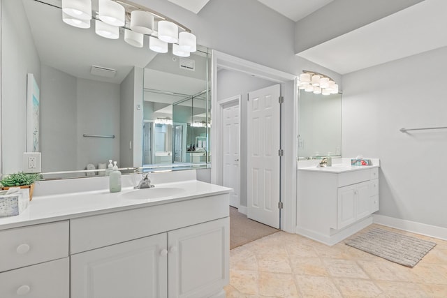 164 Blue Lupine Way Unit 411, Santa Rosa Beach, FL 32459 - bathroom featuring two vanities and baseboards
