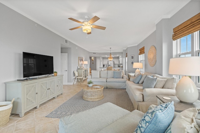 164 Blue Lupine Way Unit 411, Santa Rosa Beach, FL 32459 - living room with crown molding and a ceiling fan