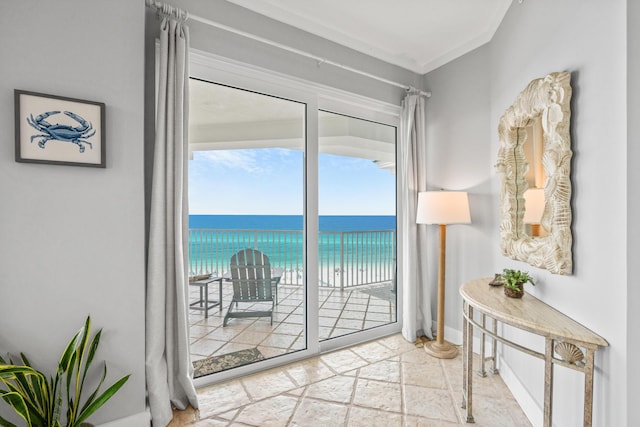 164 Blue Lupine Way Unit 411, Santa Rosa Beach, FL 32459 - doorway with stone tile flooring, a water view, and crown molding