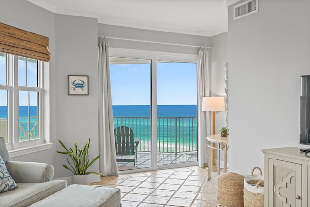 164 Blue Lupine Way Unit 411, Santa Rosa Beach, FL 32459 - living area featuring stone tile flooring, a water view, and healthy amount of natural light