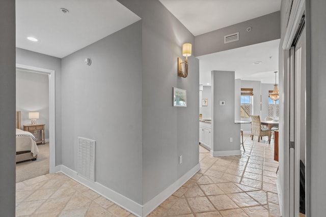 164 Blue Lupine Way Unit 411, Santa Rosa Beach, FL 32459 - hallway featuring stone tile flooring and recessed lighting