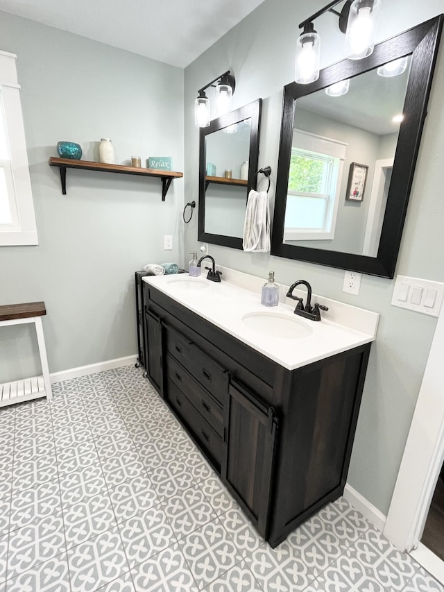 612 NE Powell Dr, Fort Walton Beach, FL 32547 - full bathroom with double vanity and baseboards
