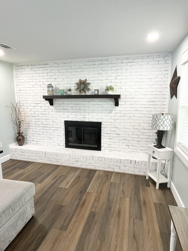 612 NE Powell Dr, Fort Walton Beach, FL 32547 - living area featuring wood finished floors and a fireplace
