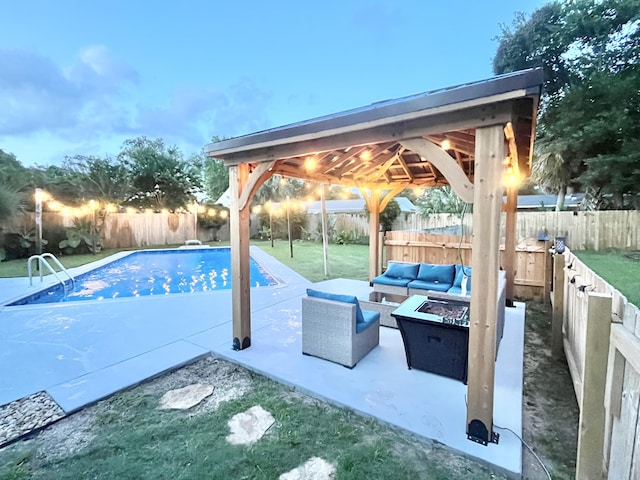 612 NE Powell Dr, Fort Walton Beach, FL 32547 - view of swimming pool featuring a gazebo, a fenced backyard, a patio, and an outdoor living space with a fire pit