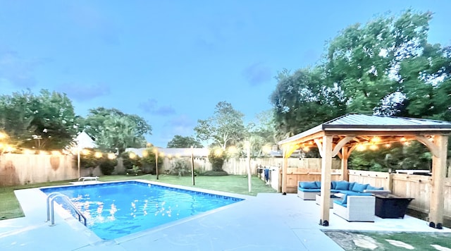 612 NE Powell Dr, Fort Walton Beach, FL 32547 - view of swimming pool with outdoor lounge area, a gazebo, a patio area, and a fenced backyard