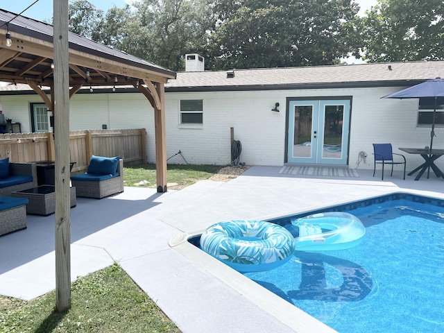 612 NE Powell Dr, Fort Walton Beach, FL 32547 - outdoor pool featuring a patio, french doors, a gazebo, and outdoor lounge area