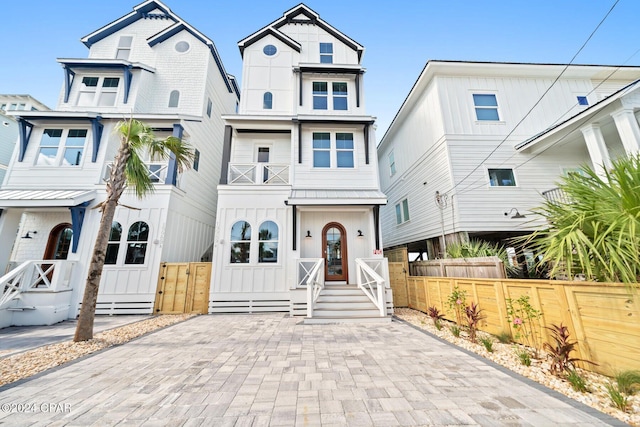19989 Front Beach Rd, Panama City Beach, FL 32413 - view of front of house with board and batten siding and a balcony