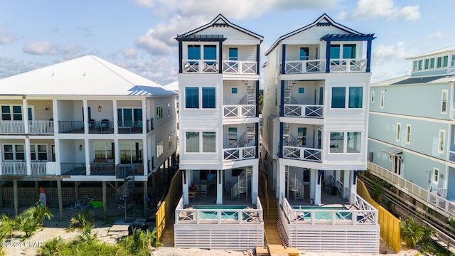19989 Front Beach Rd, Panama City Beach, FL 32413 - rear view of house with an outdoor pool