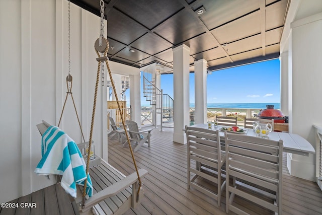 19989 Front Beach Rd, Panama City Beach, FL 32413 - wooden terrace featuring stairway, a water view, and outdoor dining space