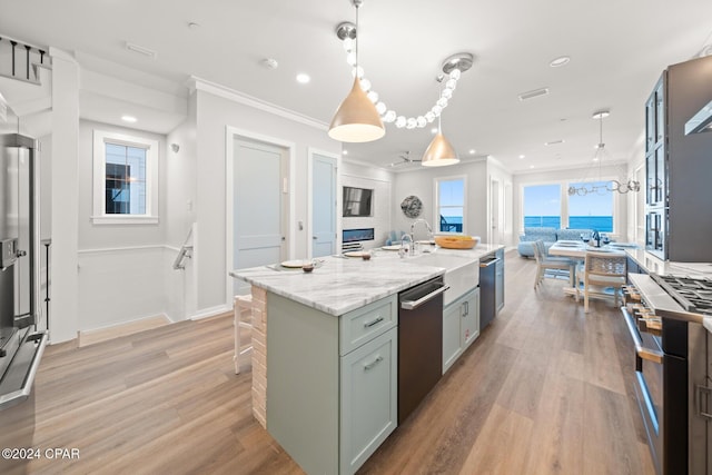 19989 Front Beach Rd, Panama City Beach, FL 32413 - kitchen featuring stainless steel appliances, light wood-type flooring, open floor plan, recessed lighting, and ornamental molding
