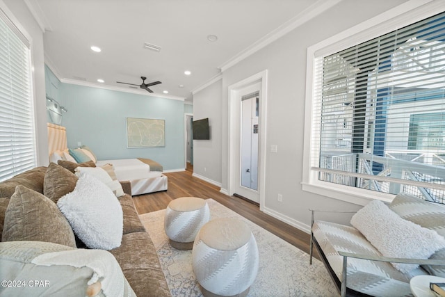 19989 Front Beach Rd, Panama City Beach, FL 32413 - living area featuring crown molding, healthy amount of natural light, wood finished floors, a ceiling fan, and recessed lighting