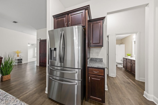 8152 Nevada St, Navarre, FL 32566 - kitchen with stainless steel refrigerator with ice dispenser, dark wood finished floors, and dark brown cabinetry