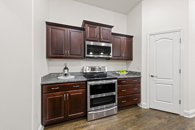 8152 Nevada St, Navarre, FL 32566 - kitchen featuring appliances with stainless steel finishes, dark wood-style floors, and dark brown cabinets
