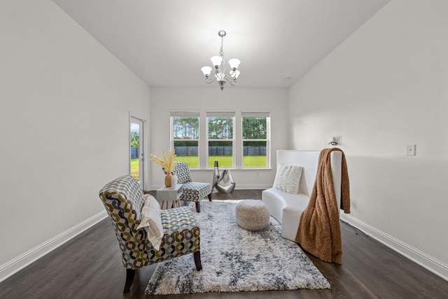 8152 Nevada St, Navarre, FL 32566 - sitting room featuring a chandelier and dark wood-style floors