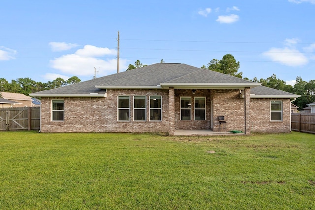 8152 Nevada St, Navarre, FL 32566 - rear view of house featuring a patio, a shingled roof, a fenced backyard, brick siding, and ceiling fan