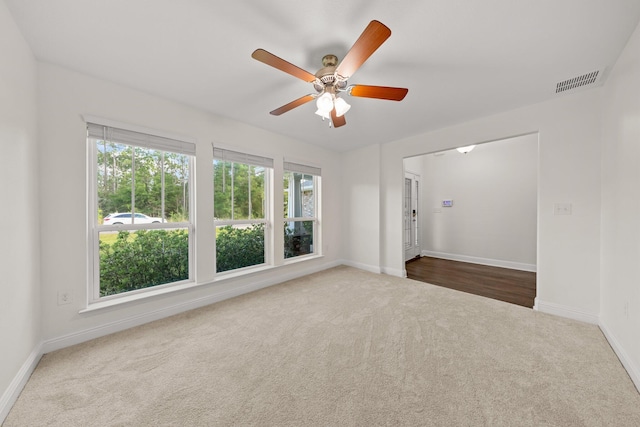 8152 Nevada St, Navarre, FL 32566 - spare room featuring carpet floors and a ceiling fan