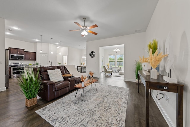 8152 Nevada St, Navarre, FL 32566 - living room with a ceiling fan, dark wood finished floors, a chandelier, and recessed lighting