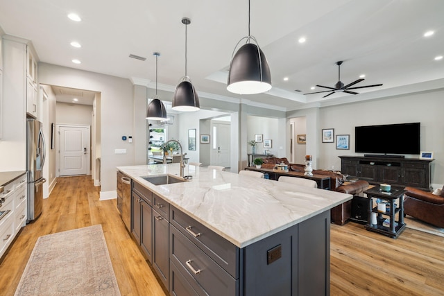 508 W Point Washington Rd, Santa Rosa Beach, FL 32459 - kitchen featuring open floor plan, white cabinets, recessed lighting, appliances with stainless steel finishes, and a kitchen island with sink