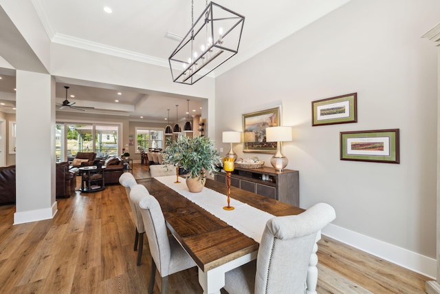 508 W Point Washington Rd, Santa Rosa Beach, FL 32459 - dining room featuring ornamental molding, light wood-type flooring, a raised ceiling, recessed lighting, and a ceiling fan