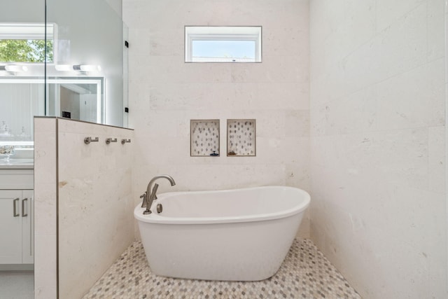 508 W Point Washington Rd, Santa Rosa Beach, FL 32459 - bathroom with a soaking tub, vanity, and tile walls