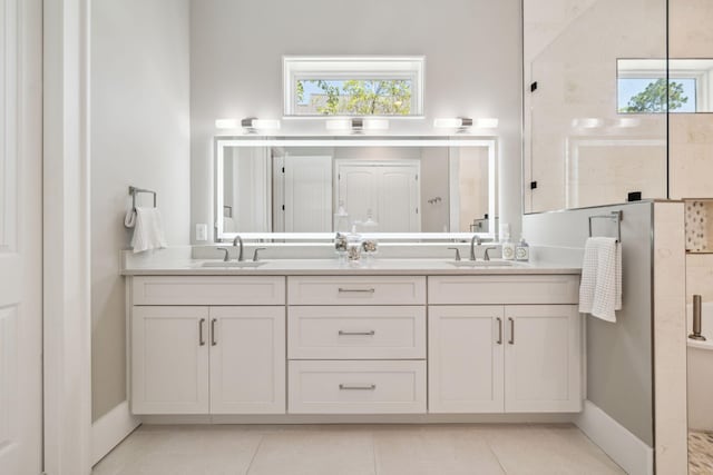508 W Point Washington Rd, Santa Rosa Beach, FL 32459 - bathroom with double vanity, walk in shower, tile patterned flooring, and plenty of natural light