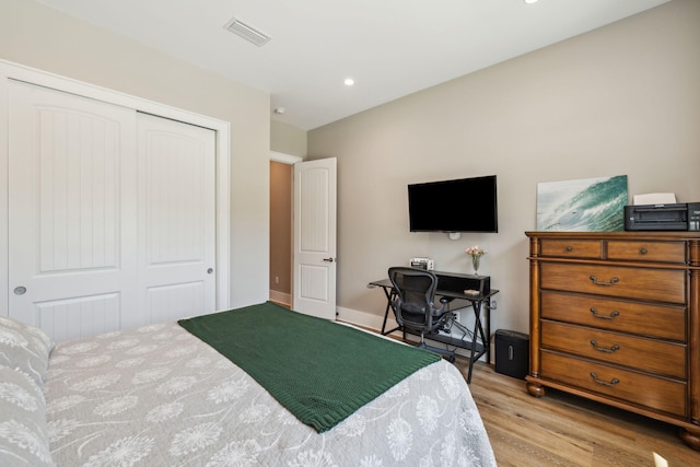 508 W Point Washington Rd, Santa Rosa Beach, FL 32459 - bedroom featuring a closet, wood finished floors, and recessed lighting
