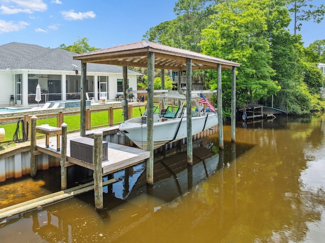 508 W Point Washington Rd, Santa Rosa Beach, FL 32459 - dock area featuring boat lift, a water view, and a swimming pool