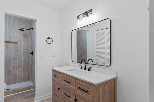 1816 Madelons Path, Fort Walton Beach, FL 32547 - full bathroom featuring vanity, tiled shower, and wood finished floors