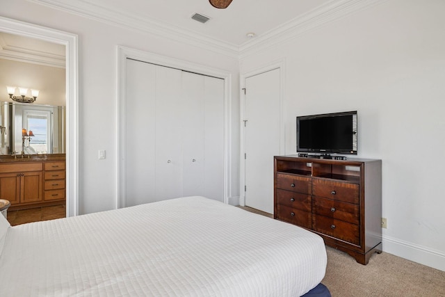 19108 Front Beach Rd Unit A & B, Panama City Beach, FL 32413 - carpeted bedroom with a closet, ornamental molding, and ensuite bath
