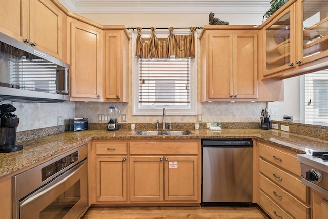 19108 Front Beach Rd Unit A & B, Panama City Beach, FL 32413 - kitchen featuring appliances with stainless steel finishes, healthy amount of natural light, backsplash, and glass insert cabinets