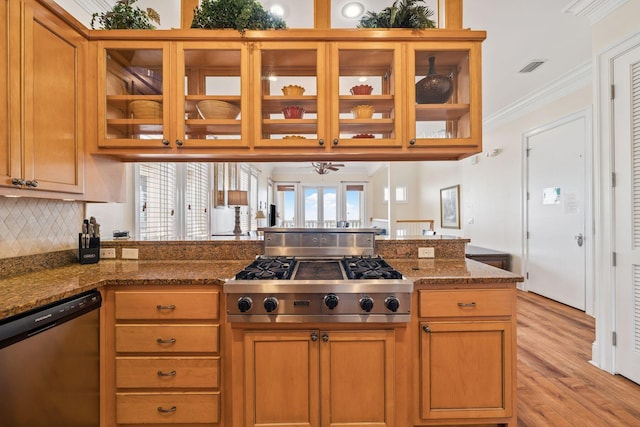 19108 Front Beach Rd Unit A & B, Panama City Beach, FL 32413 - kitchen with appliances with stainless steel finishes, light wood-type flooring, glass insert cabinets, decorative backsplash, and dark stone countertops