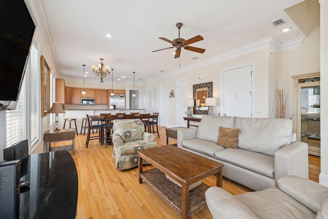 19108 Front Beach Rd Unit A & B, Panama City Beach, FL 32413 - living area with light wood-style floors, ceiling fan, ornamental molding, recessed lighting, and a chandelier