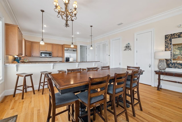 19108 Front Beach Rd Unit A & B, Panama City Beach, FL 32413 - dining area featuring light wood finished floors, crown molding, a chandelier, and recessed lighting