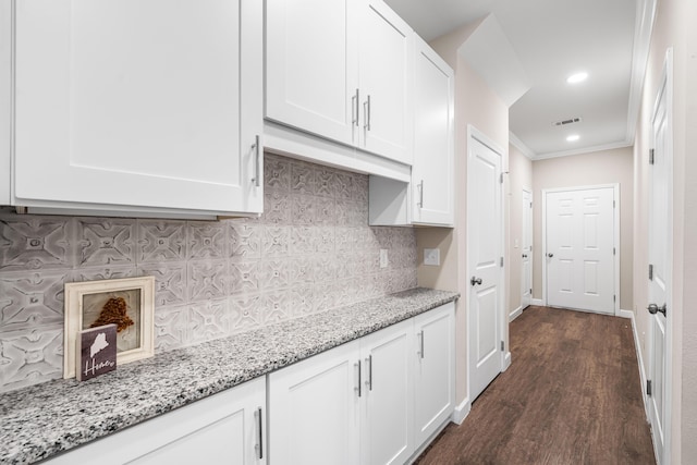 1819 Stable Ln, Fort Walton Beach, FL 32547 - kitchen featuring white cabinetry, dark wood-type flooring, light stone counters, backsplash, and recessed lighting
