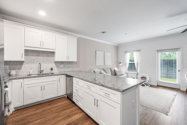 1819 Stable Ln, Fort Walton Beach, FL 32547 - kitchen featuring a peninsula, crown molding, dishwasher, white cabinets, and dark wood-style flooring
