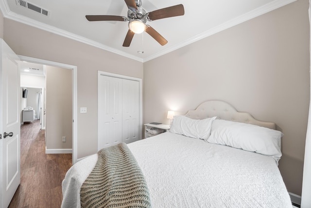 1819 Stable Ln, Fort Walton Beach, FL 32547 - bedroom with crown molding, wood finished floors, a closet, and a ceiling fan