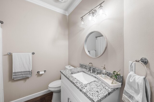 1819 Stable Ln, Fort Walton Beach, FL 32547 - bathroom with ornamental molding, vanity, and wood finished floors
