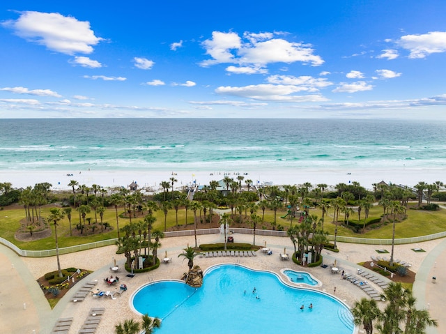 15100 Emerald Coast Pkwy Unit 602, Destin, FL 32541 - community pool with view of water and beach and a patio area