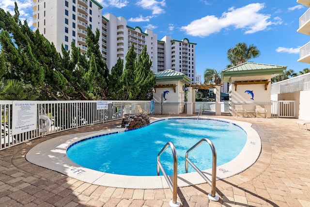 15100 Emerald Coast Pkwy Unit 602, Destin, FL 32541 - community pool featuring a patio