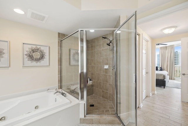 15100 Emerald Coast Pkwy Unit 602, Destin, FL 32541 - bathroom featuring a tub with jets, ensuite bathroom, a shower stall, and recessed lighting