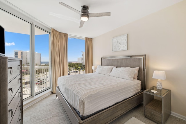 15100 Emerald Coast Pkwy Unit 602, Destin, FL 32541 - bedroom with access to exterior, light wood finished floors, and ceiling fan