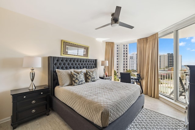 15100 Emerald Coast Pkwy Unit 602, Destin, FL 32541 - bedroom with access to exterior, light wood-style flooring, and ceiling fan