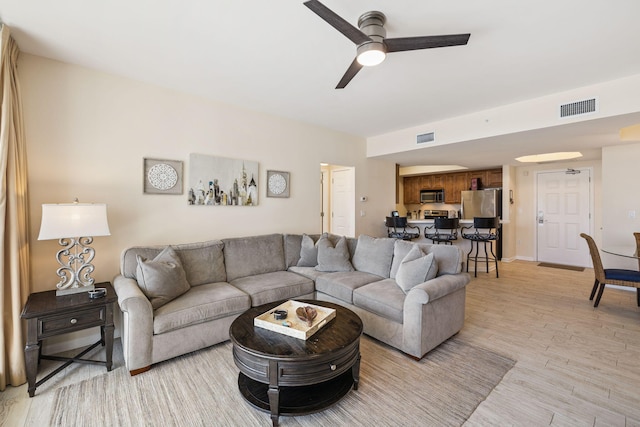 15100 Emerald Coast Pkwy Unit 602, Destin, FL 32541 - living room with a ceiling fan and light wood finished floors