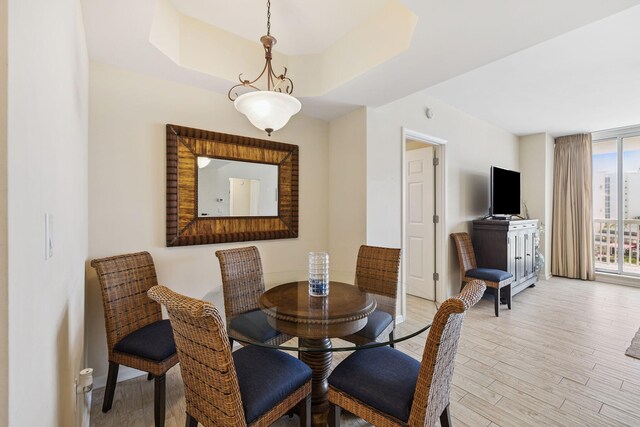 15100 Emerald Coast Pkwy Unit 602, Destin, FL 32541 - dining area featuring wood finished floors and floor to ceiling windows