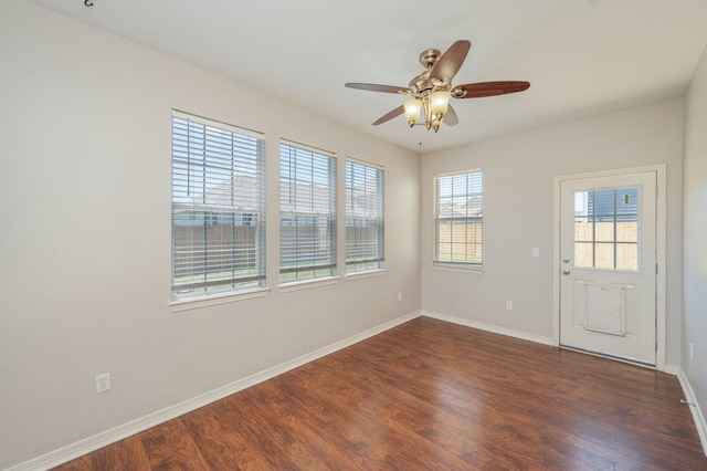 715 Presscott St, Crestview, FL 32536 - empty room with dark wood finished floors and ceiling fan