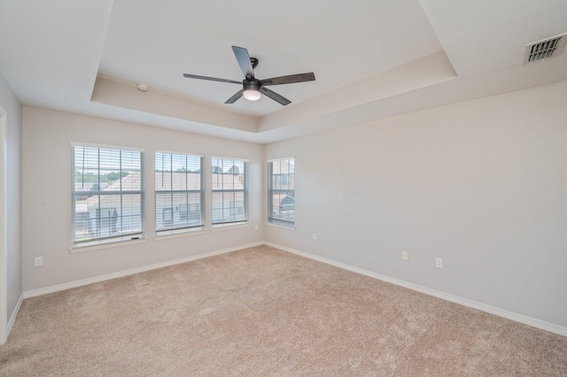 715 Presscott St, Crestview, FL 32536 - unfurnished room featuring ceiling fan, a raised ceiling, carpet flooring, and a smoke detector